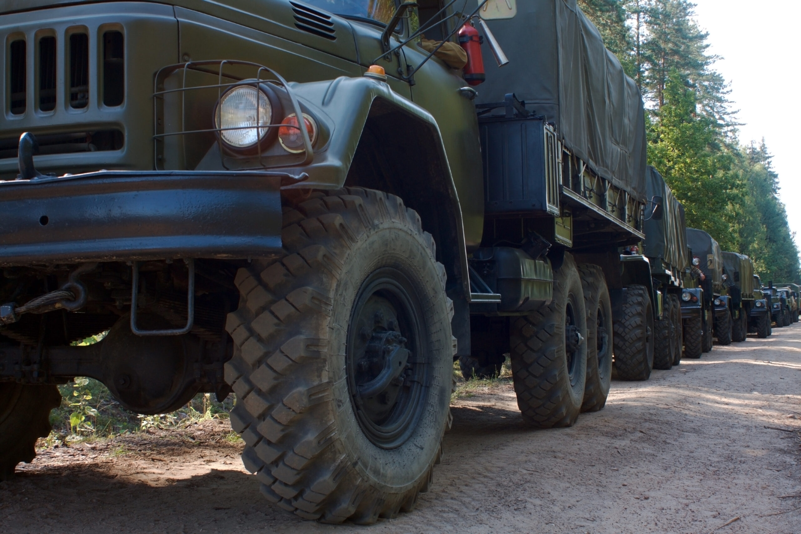 a column of military vehicles a column of military vehicles